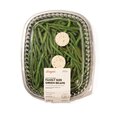 Family-size garlic butter green beans in a sealed ready-to-heat container, topped with herb butter for serving.